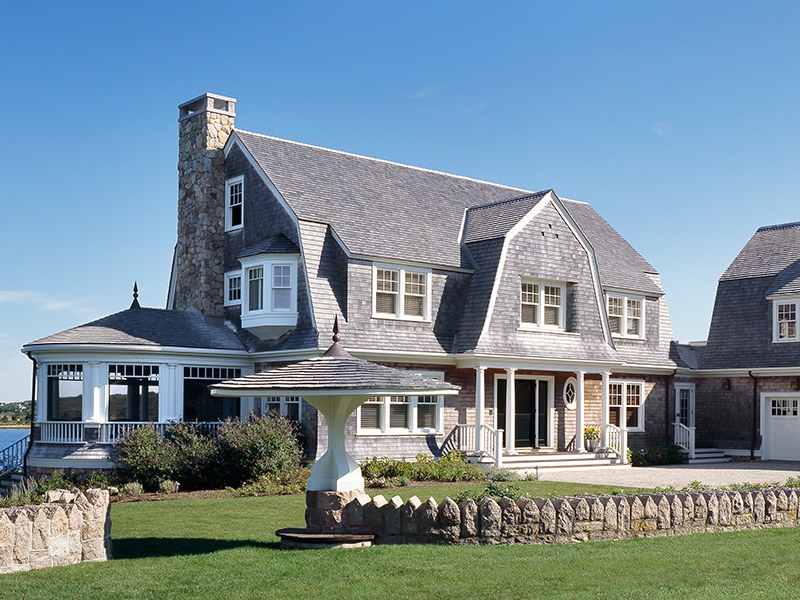 cape cod style home with large front year
