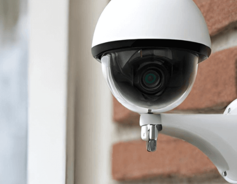 security camera on a home with brick siding