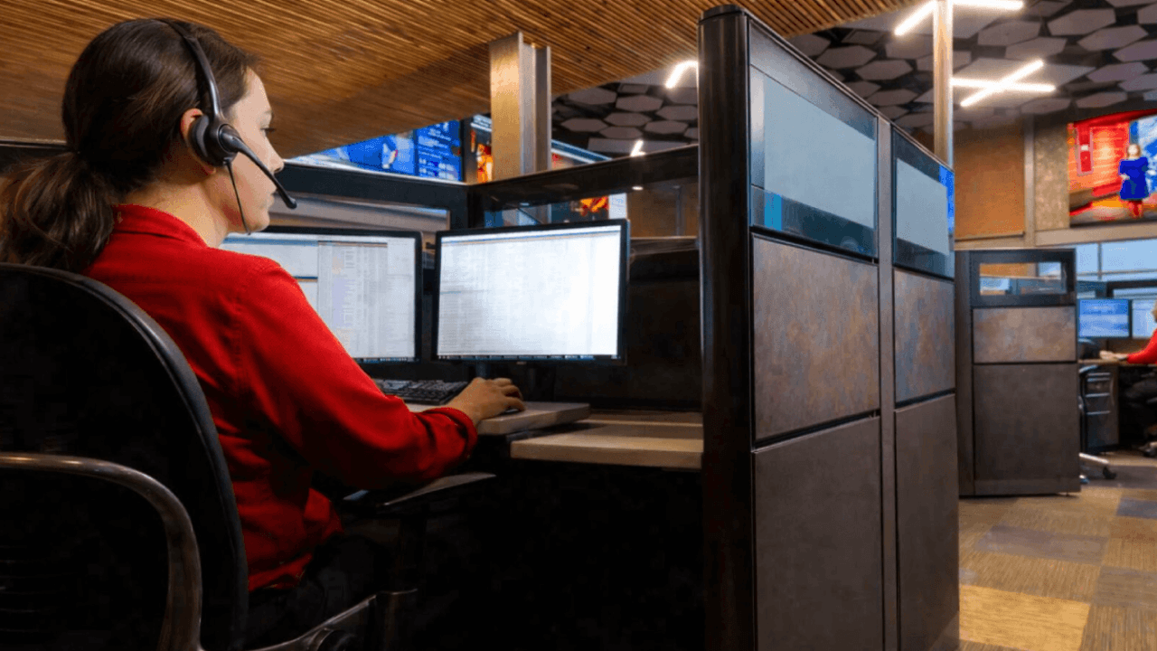 woman working at alarm monitoring station